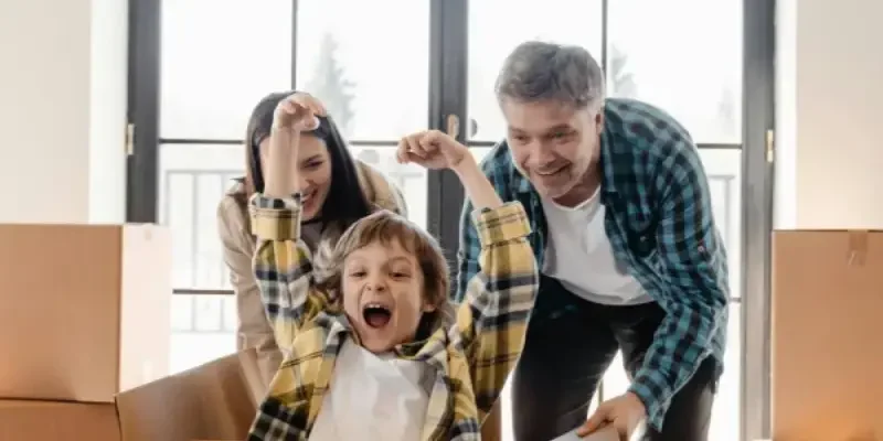 family playing together whilst moving into their newly built home protected by the halo 10-year residential guarantee