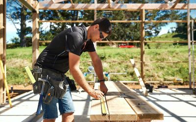 nzcb builder working at a saw horse to cut wood